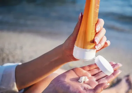 Professional sunscreen application for UV protection in UAE indoor settings by Revo Pharmaceuticals.